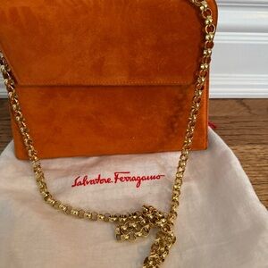 Authentic Salvatore Ferragamo Orange Suede Clutch with Gold Chain